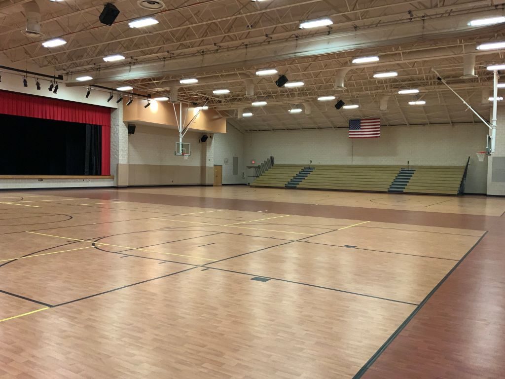 The gym floor at the Mebane Arts & Community Center, where the tables will be set up